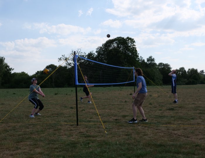 A rally in progress with the ball above the net