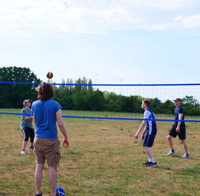 A player bumping the ball back over the net